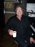 The AJ Jazz Band Drummer of jazz band having a cup of tea.  Band play for parties and weddings in Do