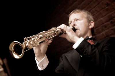 Solo saxophonist Mike Sax playerwith red flower buttonhole. He plays in Humberside,Yorkshire and Dur