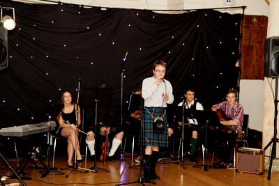The CM Scottish Ceilidh Band Young band on stage. They play in London, Sussex and Hampshire