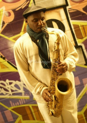 Solo Saxophonist - Richie Saxophonist wearing scarf. He plays in Somerset, Suffolk, Surrey