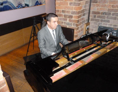 Pianist  - Jay Pianist who plays in North Wales and Staffordshire wearing grey lounge suit