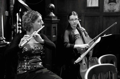 The AC Flute & Cello Duo Black & white photo of flute & cello duo who play in Buckinghamshire and He